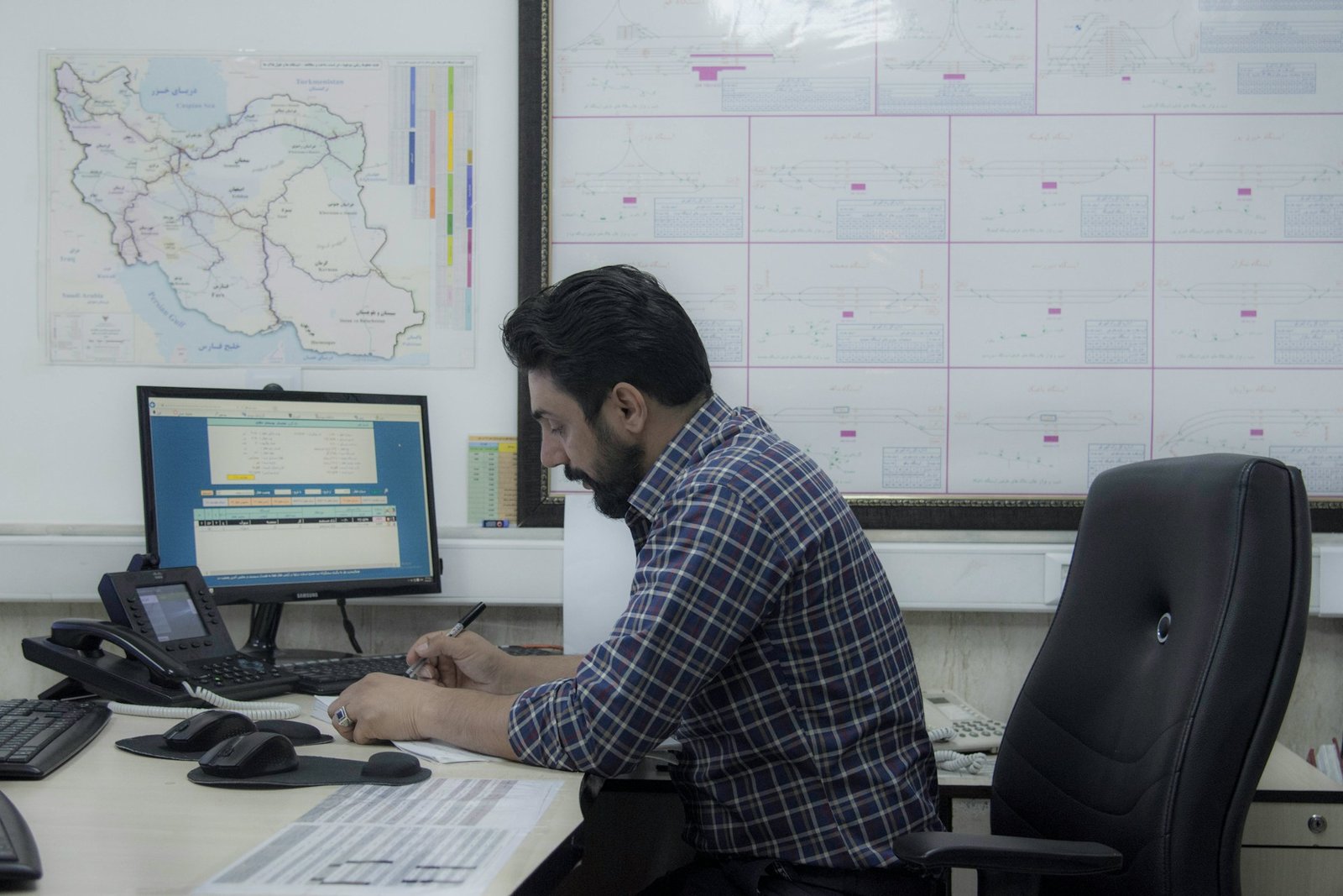 Chartered Project Manager leading a project team review