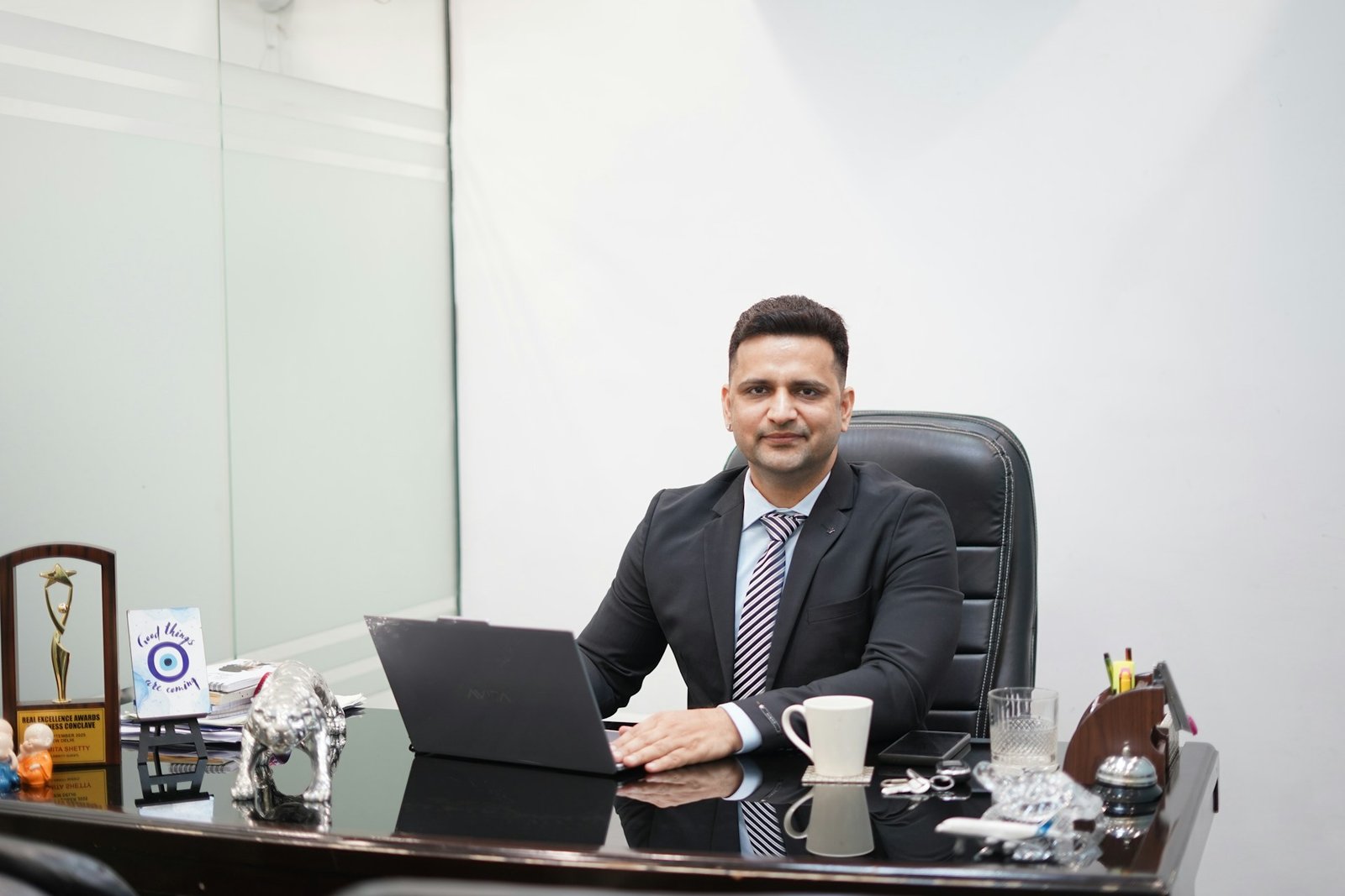Chartered Global Supply Chain and Logistics Manager reviewing operations at a shipping port