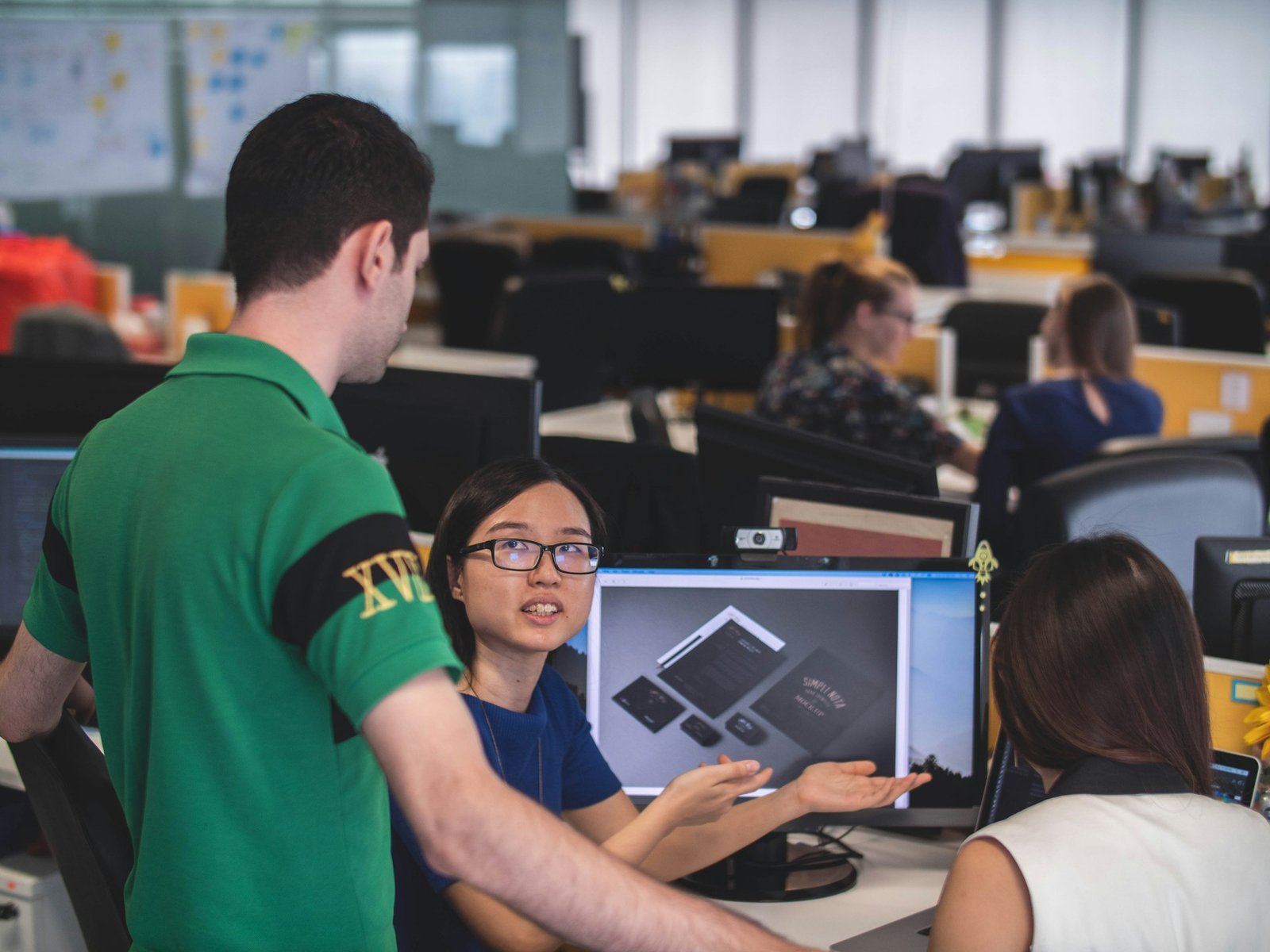 Chartered Procurement Manager reviewing sourcing strategy with a supply chain team